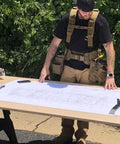 Worker with blueprint wearing Comfort Tuff V2 Heavy Duty Suspenders For Workwear One Size Fits Most Coyote USA Made Rugged Construction