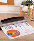 Office Workhorse 3 Hole Paper Punch with adjustable 2 to 3 hole settings, 10 sheet capacity, heavy-duty metal puncher in black and silver on desk