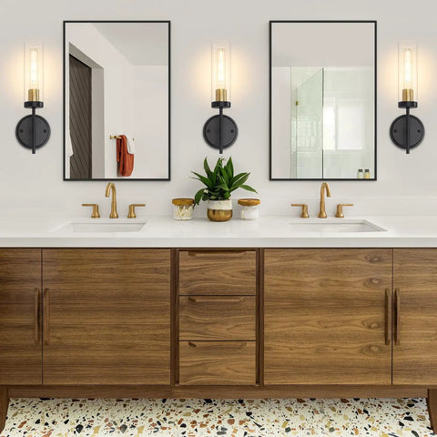 Black Wall Sconce Lighting Modern Vanity Fixture With Clear Glass Shades above bathroom vanity with mirrors.