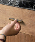 Person installing Six Pack Antique Brass Finger Pulls For Cabinets And Drawers, Solid Zinc Alloy Hardware With 3-3/4 Inch Hole Center