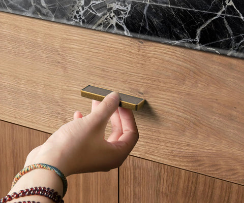 Person installing Six Pack Antique Brass Finger Pulls For Cabinets And Drawers, Solid Zinc Alloy Hardware With 3-3/4 Inch Hole Center