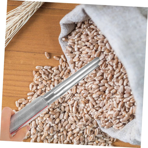 Person using Stainless Steel Grain Sampler With Rubber Handle Portable Fertilizer Probe For Accurate Wheat Seed And Soil Sampling Durable Farm And Laboratory Use on wheat
