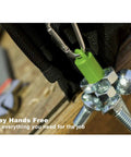 Close-up of Three Pack Heavy Duty Neodymium Magnet Set Anti Rust Holds Up To 12 Lbs with key ring clipped to tool belt.