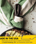 Round Cast Iron Griddle Pan 10.5 Inch Pre Seasoned Non Toxic PFAS Free Cookware with handle and cooked food, USA made tag