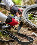 Cyclist using Two Pack 2 Inch By 50 Inch Duct Tape Industrial Strength for Backcountry Repairs, Silver Utility Tape on bike tire