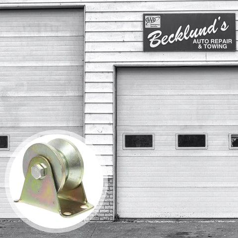 Four Piece Heavy Steel V Groove Caster Wheels For Sliding Gates And Store Doors With Precision Machined Pulley Block close-up on steel wheel with bracket.