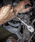 Person using the One Half Inch Drive Teardrop Ratchet With Full Polish Chrome Finish, 120XP Heavy Duty Workhorse on car machinery.