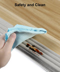 High Density NBR Foam Baby Proofing Edge Protectors With Super Sticky Pre Taped Adhesive For Sharp Corners Toddler Tables Desks Furniture Safety Cushions In Classic Grey Finish Totally Zero Sweat Peel Stick Guard being cleaned with cloth.
