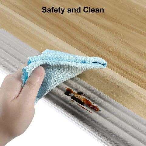 High Density NBR Foam Baby Proofing Edge Protectors With Super Sticky Pre Taped Adhesive For Sharp Corners Toddler Tables Desks Furniture Safety Cushions In Classic Grey Finish Totally Zero Sweat Peel Stick Guard being cleaned with cloth.