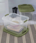 Heavy Duty 2 Pack 40 Quart Clear Plastic Storage Bins Stackable Totes With Secure Snap Lids and Grip Carry Handles in use with clothes.