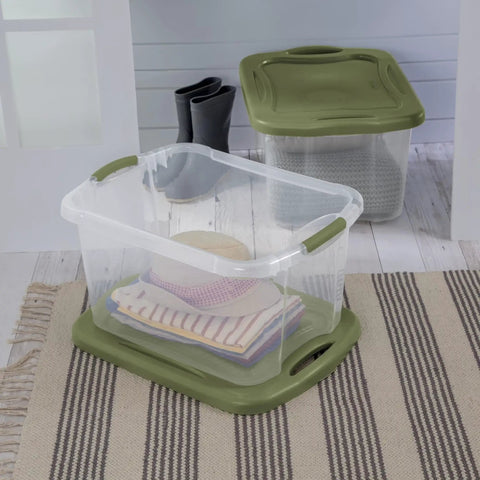 Heavy Duty 2 Pack 40 Quart Clear Plastic Storage Bins Stackable Totes With Secure Snap Lids and Grip Carry Handles in use with clothes.