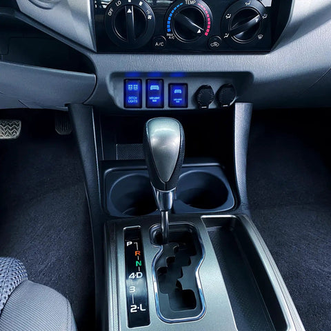 Interior view showing Push Button Ditch Lights Switch 12V On Off With Wire Harness Kit installed in Toyota dashboard.