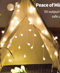 Fairy Curtain Lights USB Powered And Battery Operated 13ft 96 LED Globe Icicle String in tent with warm white light