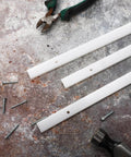3 UHMW bars for jigs and tablesaw with tools and screws on a textured surface; 4 Pcs UHMW Precision Milled Bar For Jigs Crosscut Sled For Table Saw Sled Fixtures Or Miter Slots Three Quarters By Three Eighths Inch 17 Inch Long Miter Bar Slider Gauge Rod For Router And Bandsaw Use visible