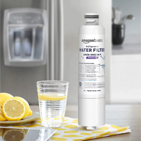 Samsung DA29-00020B Refrigerator Water Filter Cartridge positioned on a kitchen counter next to a glass of lemon water