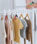 40 Pack Round White Plastic Closet Rack Dividers Preprinted With 8 Sizes XXS To XXXL For Easy Organization on rod with shirts