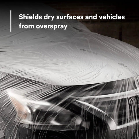 Close-up of a car front covered with overspray protective sheeting for painting, translucent high density tear-resistant masking film.