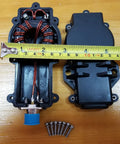 3-54 MHz 1:1 Current Balun For Dipole Antennas, open casing view with toroid core and screws on wooden table