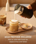 Vertuo Plus Single Serve Coffee And Espresso Maker With Aeroccino Milk Frother pouring milk into coffee on wooden tray