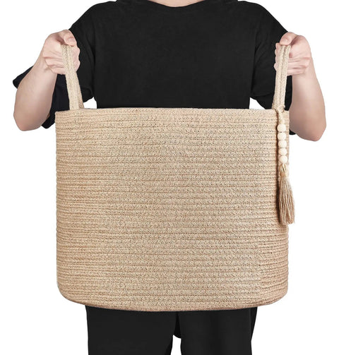 Person holding a Woven Rope Storage Basket With Handles For Blankets, Toys, Clothes And Plants, Natural Jute Organizer Bin