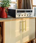 Solid Brass Kitchen Cabinet Pulls Set of 6 in Polished Gold with Hammered T-Bar Handles on a wooden cabinet