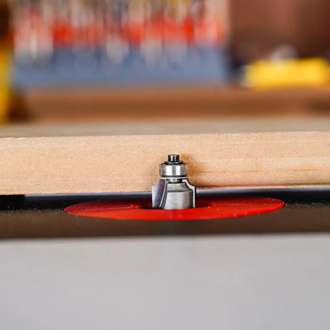 Top Shelf 1/8 Inch Radius Roundover Router Bit With Sharp Carbide Cutting Tips and Rock Solid Bearing Guide in use on a woodworking table.