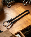 Ranch Tough Horse Stall Gate Latch With Twist Lock And Secure Barn Door Fastener designed for pasture gates, featuring black braided rope.