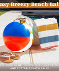 4 Pack 20 Inch Rainbow Beach Balls Large Inflatable Pool Toys For Parties Decorations For Adults And Kids Luau Summer Beach Water Games Beach Ball Favors beside striped towel and sunglasses by pool.