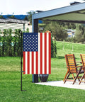 American Flag Garden Flag 12 Inch By 18 Inch Double Sided Patriotic Yard Decor for garden and lawn perfect Fourth of July Memorial Day outdoor display fade resistant nylon with chairs in the background.