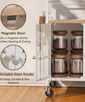 Close-up of the magnetic door and storage jars of the Slick 3 Tier Rolling Coffee Bar Cart For Compact Kitchens Featuring Space Savvy Corner Layout Easy Glide Casters And Nifty K Cup Pod Rack Plus Storage Hooks.