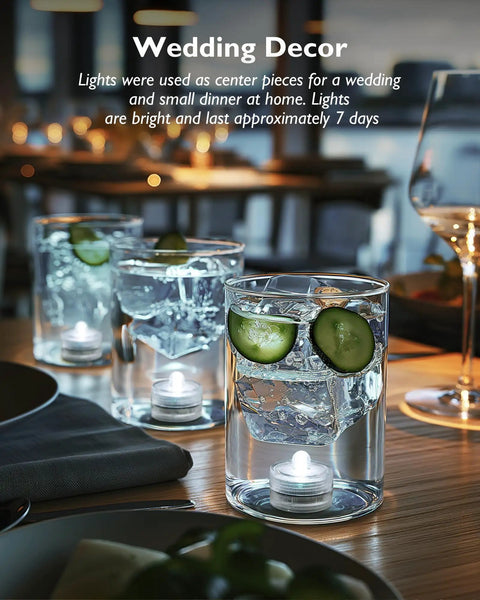 Mini Submersible LED Lights With Remote RGB Multicolor Waterproof Tealight Candles in water glasses at wedding dinner