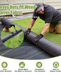 Man installing black Heavy Duty Weed Barrier Landscape Fabric 3Ft By 50Ft With 10 U Shaped Pegs And 10 Gaskets Geotextile Ground Cover