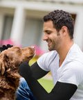 Man wearing Kevlar Gloves With Sleeves Level Five Cut And Heat Resistant Safety Gear petting a dog.