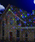 House illuminated with Outdoor Christmas Laser Projector Lights With Remote Control RGB Firefly Motion Effects at night.