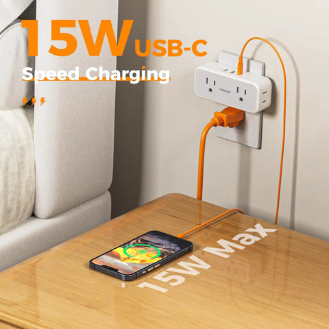 Compact 7 In 1 Wall Outlet Extender Converts One Socket To Four AC Outlets And Three USB Charging Ports Making Your Home Desk A Hella Smooth Charging Setup With Zero Sweat Ever Needed with USB-C cable charging smartphone.