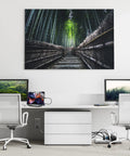 A minimalistic home office setup featuring two computers, a tablet, and a bamboo forest wall art backdrop.
