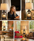 Rustic Lantern Table Lamp For Living Room And Bedroom End Table With Oatmeal Tapered Drum Shade, Built In USB Ports And AC Outlet in cozy home settings.