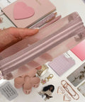 Hand holding pink pouch from Aesthetic Stationery Gift Set 22 Piece Bundle With Journal Box Blush Pink Includes Pencil Pouch Pens