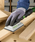 Using Ergonomic Hand Sanding Block With Easy Grip Handle And Suction Bypass For Precise 80 mm By 133 mm Sandpaper on wood