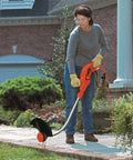 Woman using lawn edger with Replacement Trimmer Spool Pack For Black Decker GH1100 GH1000 GH2000 30ft 0.080 In Dual Auto Feed Spool 4 Pack CNC Wound