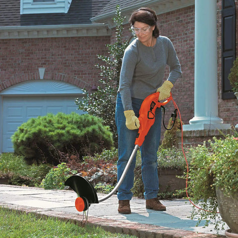 Woman using lawn edger with Replacement Trimmer Spool Pack For Black Decker GH1100 GH1000 GH2000 30ft 0.080 In Dual Auto Feed Spool 4 Pack CNC Wound