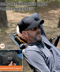 Man relaxing in Big Ol Oversized Hammock Camping Chair For Outdoors Ultra Comfort Up To 400 Lbs with padded headrest.