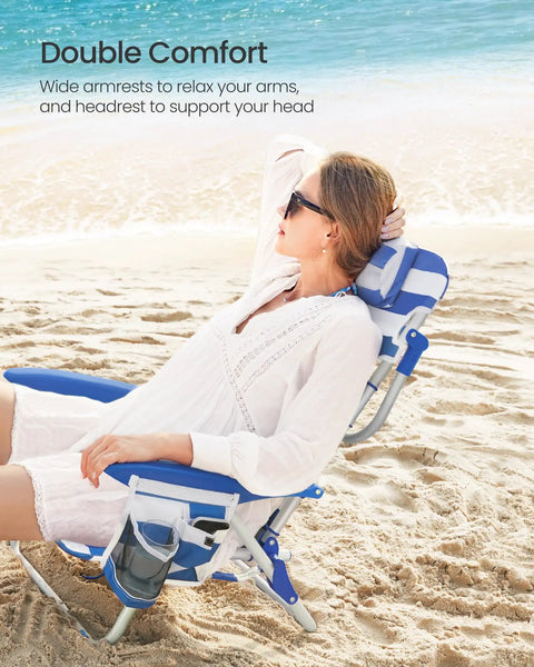 Woman enjoying comfort on backpack beach chair with four adjustable backrest angles, 331 lb capacity, blue and white design, on sand