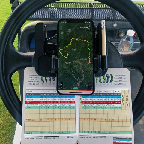 Rock Solid Golf Cart Phone Holder Steering Wheel Mount holding phone with map above scorecard on cart steering wheel.