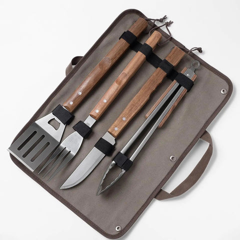 Stainless Steel BBQ Grill Tools Set With Ergonomic Wood Handles Includes Spatula Tongs Knife Fork And Carry Bag displayed neatly