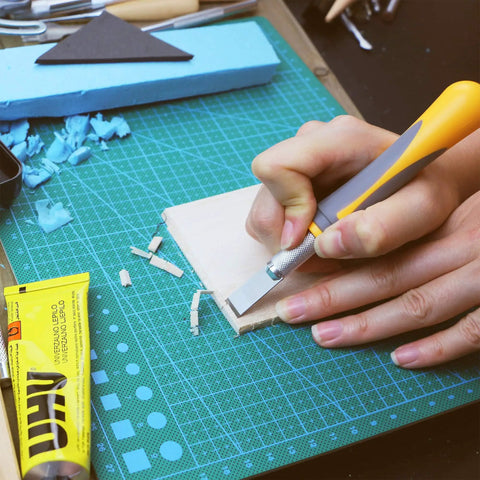 Using Exacto Knife Set For Precision Crafting, 16 Piece Hobby Knife Kit With Razor Sharp Blades on a crafting mat