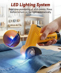 Heavy Duty Cordless Electric Scissors With 3 High Carbon Steel Blades For Cutting Cardboard Boxes Up To Quarter Inch Thick Leather And Carpet Four Speed Settings LED light illuminating denim fabric with scissors.