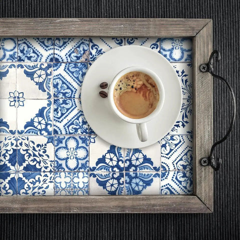 Close-up of a coffee cup on Blue Mediterranean Tile Peel And Stick Wallpaper No Mess No Water No Fuss Removable And Repositionable.