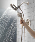 Linden 17 Series Dual Function Shower Trim Kit with 4-Spray In2ition 2-In-1 handheld shower head and hose in use, stainless steel