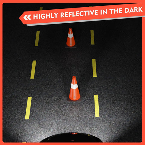 4 Pack 18 Inch Traffic Safety Cones With Heavy Duty Black Weighted Base placed on road, reflective orange PVC cones.
